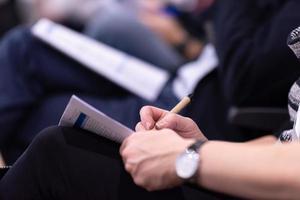 business people taking notes photo