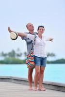 happy young couple have fun on beach photo