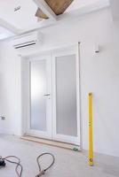 double glass door with white wooden frame photo