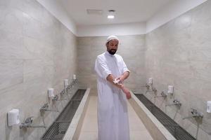 a portrait of a man in abdesthana using a towel photo