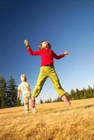 happy child jumping in nature photo