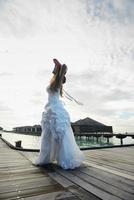 asian bride on beach photo