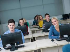 students group in computer lab classroom photo