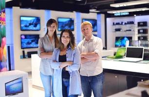 People in electronics store photo