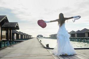 asian bride on beach photo