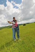 Portrait of romantic young couple smiling together outdoor photo