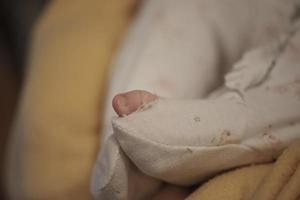 One month newborn baby sleeping  in bed photo