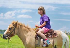 child ride pony photo