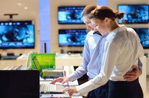 People in electronics store photo