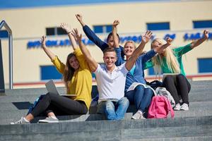 students outside sitting on steps photo