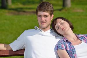 Portrait of romantic young couple smiling together outdoor photo