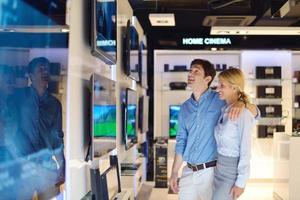 People in electronics store photo