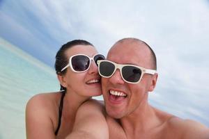 happy young  couple at summer vacation have fun and relax at beach photo