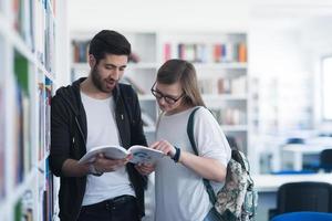 students couple  in school  library photo