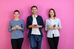 group of friends have fun and dance while using a cell phone and headphones photo