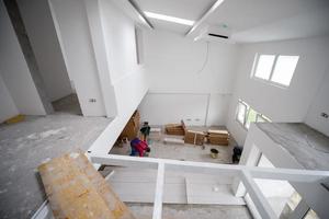 worker installing the ceramic wood effect tiles on the floor photo