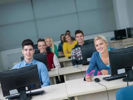 students group in computer lab classroom photo