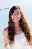 asian bride on beach photo