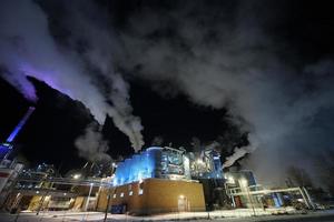 Norway, 2022 - Factory at Night Air Pollution From Industrial Smoke photo