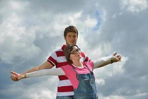 Portrait of romantic young couple smiling together outdoor photo