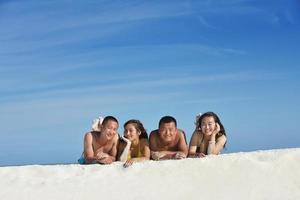 group of happy young people have fun on bach photo