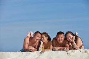 group of happy young people have fun on bach photo