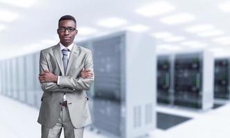 Young black man in server room photo