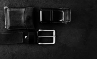 black belt, wallet and perfume photo