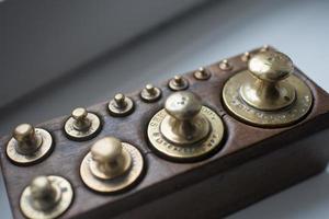 Set of traditional weights in a wooden box seen from above photo