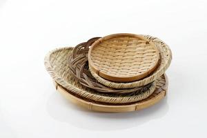 Various Bamboo and Rattan Plate, Isolated on White. Asian Traditional Dish for Food Serving photo