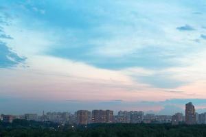 durk blue and pink dusk sky over city photo