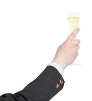 raising of champagne glass in businessman hand photo