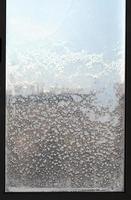 view of houses through frozen window photo