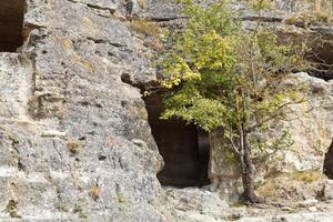 Caves of medieval town chufut kale in Crimea photo