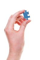 female arm with jigsaw puzzle piece photo