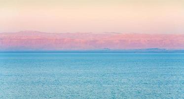 pink sunrise on Dead Sea coast photo