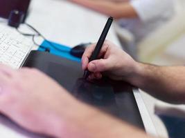 Closeup of Graphic Designer Working at Workplace photo