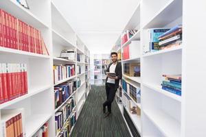 student with tablet in library photo