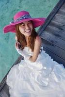 asian bride on beach photo