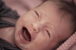 newborn baby crying and screaming photo