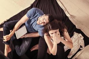 top view of couple checking a list of things for their unborn baby photo