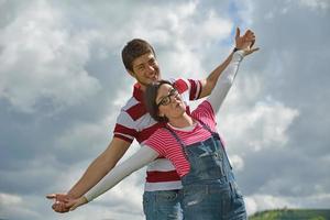 Portrait of romantic young couple smiling together outdoor photo