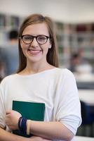 portrait of female student in library photo