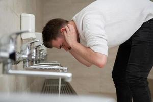 A Muslim takes ablution for prayer. Islamic religious rite photo