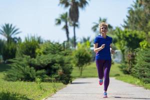 young female runner training for marathon photo