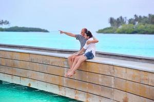 happy young couple have fun on beach photo