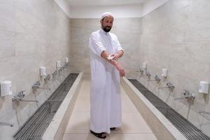 a portrait of a man in abdesthana using a towel photo
