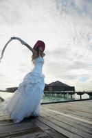 asian bride on beach photo