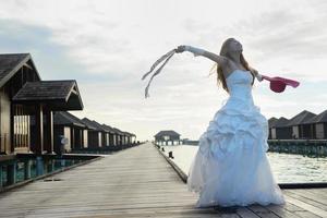 asian bride on beach photo