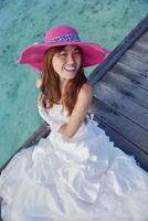 asian bride on beach photo